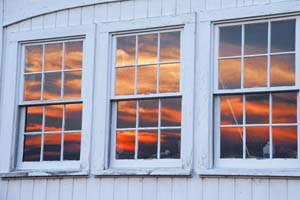 Photograph of Sunset in a Barn Window